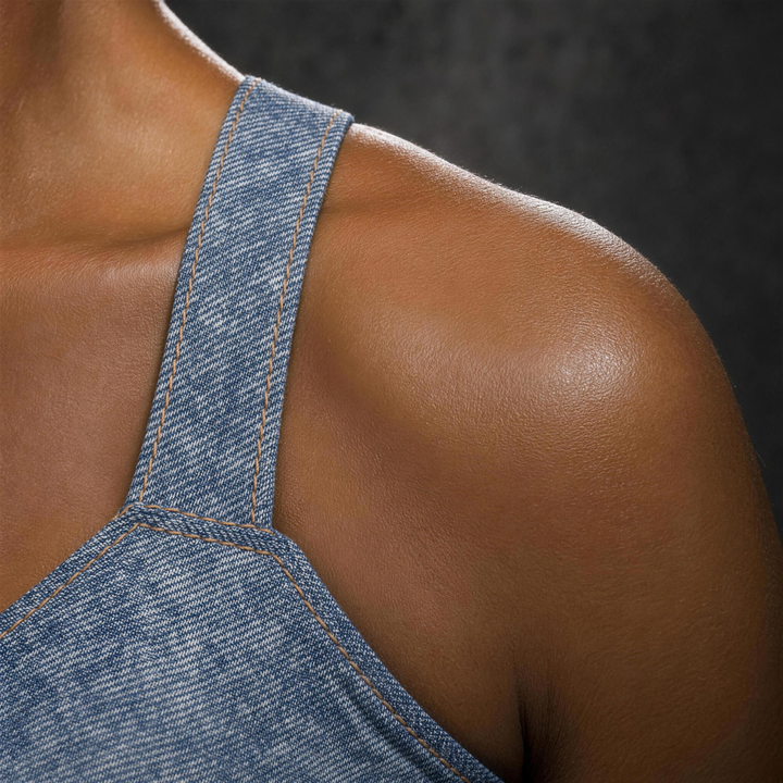 Woman wearing HIVOLT Faux Denim Sports Bra, detail closeup