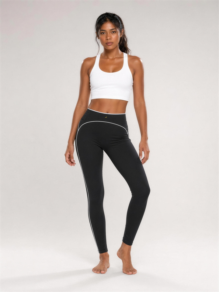 Woman wearing HIVOLT High Rise Topstitching Leggings, studio shot