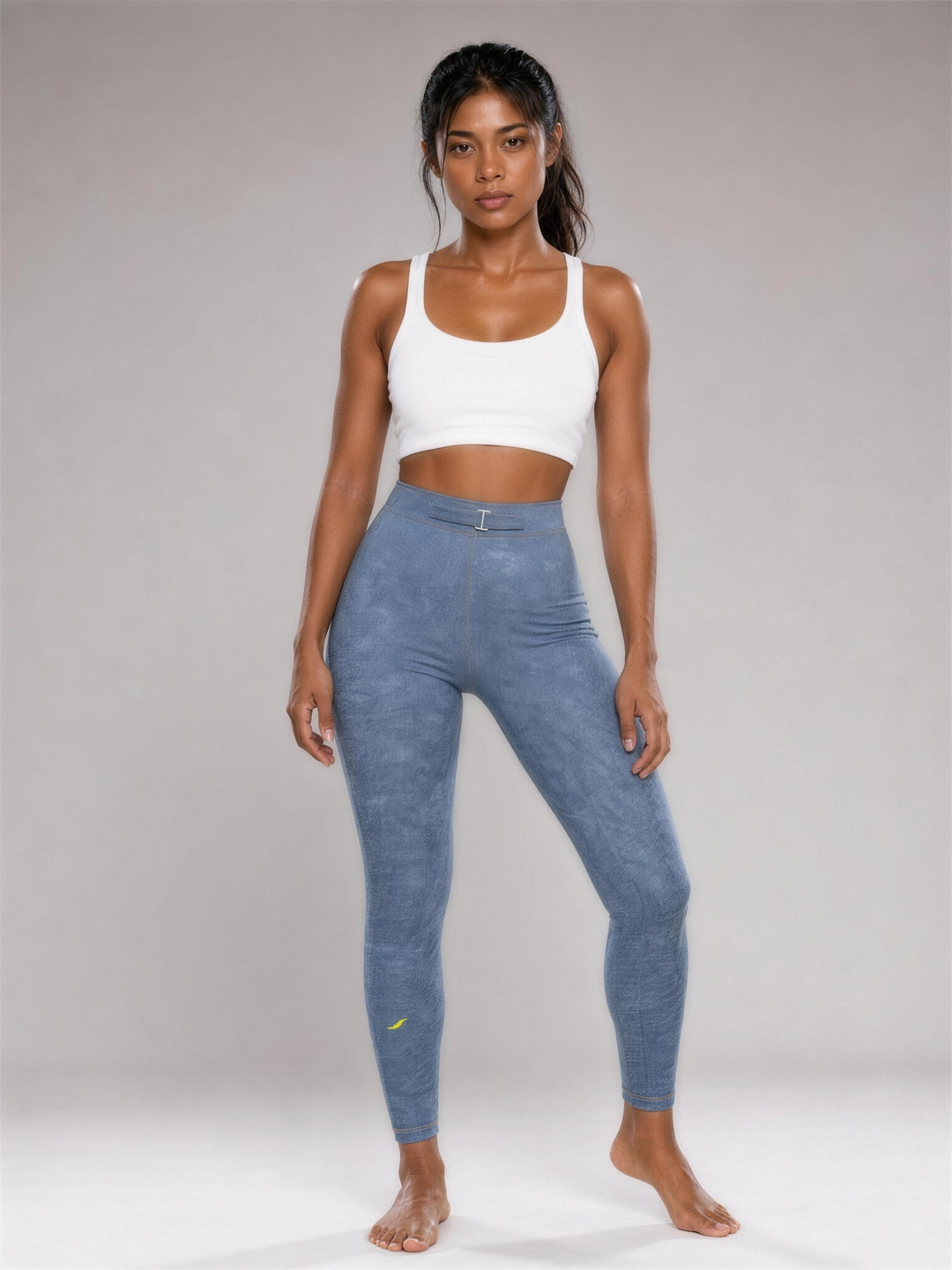 Woman wearing HIVOLT Faux Denim Zip-Fly Leggings, studio shot